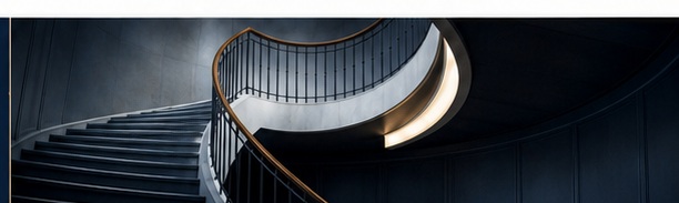 Elegant dark staircase with warm architectural lighting